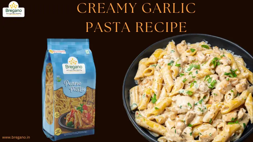A bowl of creamy garlic pasta garnished with fresh parsley and parmesan cheese.
